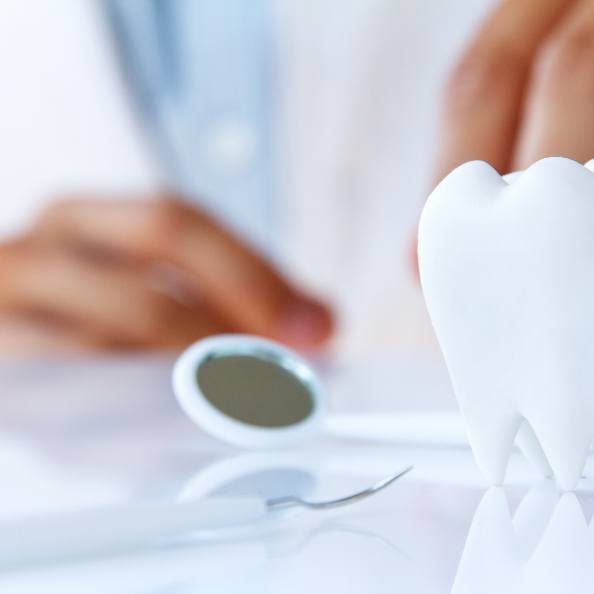 Dental treatment tools and model tooth used during dental checkups
