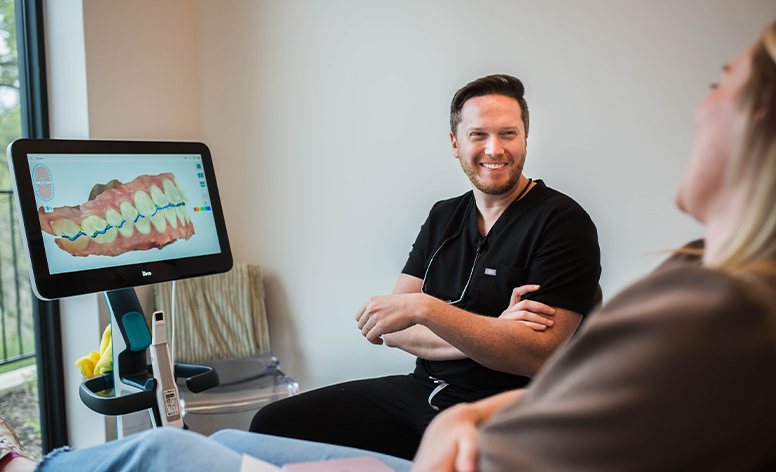 Woman with flawless smile after porcelain veneers treatment