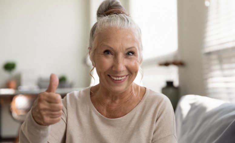 Woman with dentures smiling