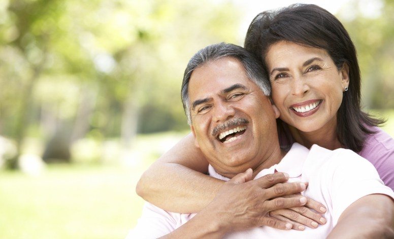Older couple enjoying the benefits of dentures