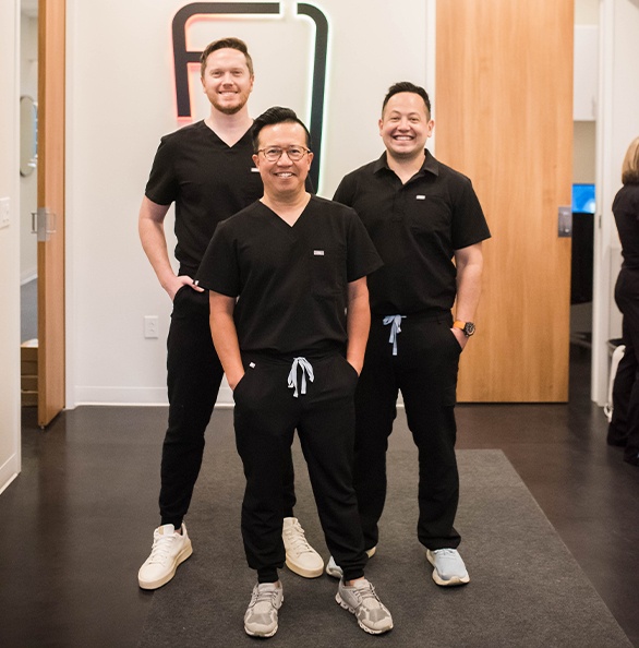 Family smiling together after family dentistry visit