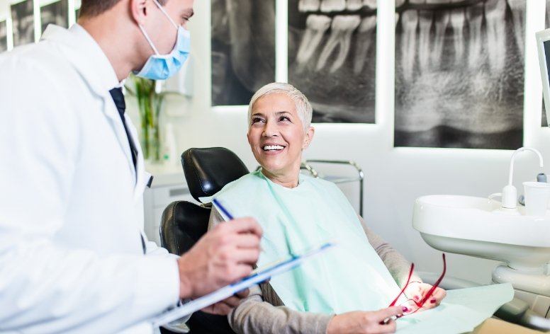 Dentist and patient discussing the dental implant process