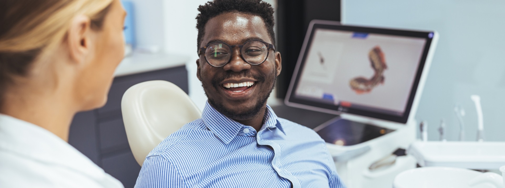 man smiling in dental chair