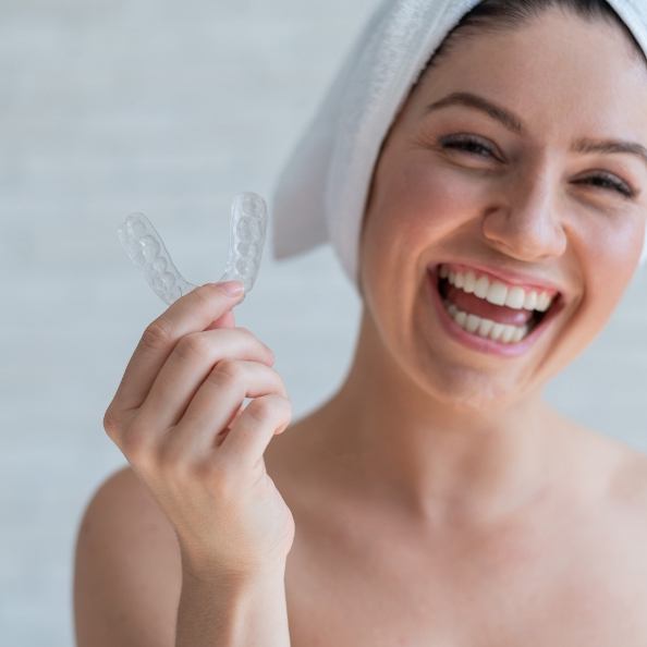 Dental patient holding nightguard