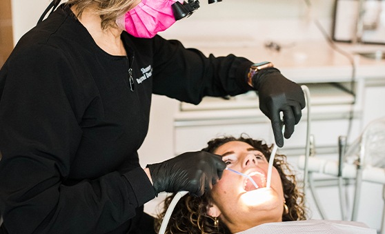 Woman holding oral conscious sedation in Fort Worth