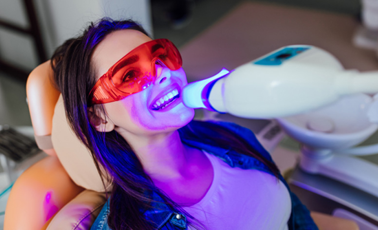 Woman having her teeth whitened