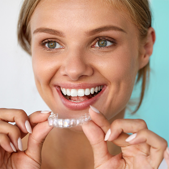 : Man smiling in dental chair