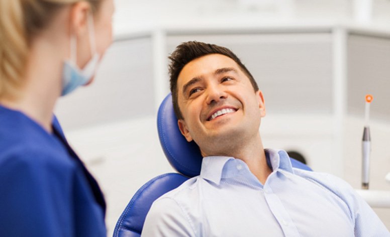 Man smiling in dental chair