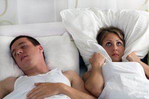 Snoring man and young woman