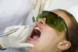 A patient receiving laser dental treatment.