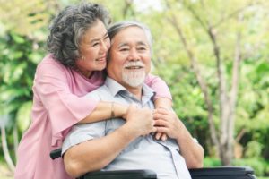 couple smiling after dental implants success