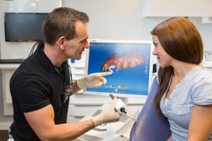 dentist making same-day dental crowns for a patient 