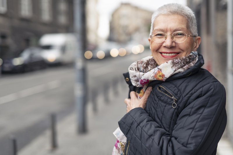 Woman smiling with dental implants