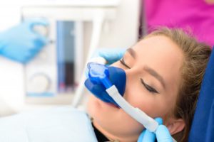 a woman being sedated at the dentist