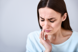 a patient suffering from facial pain