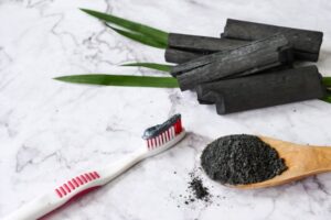 Activated charcoal on a toothbrush