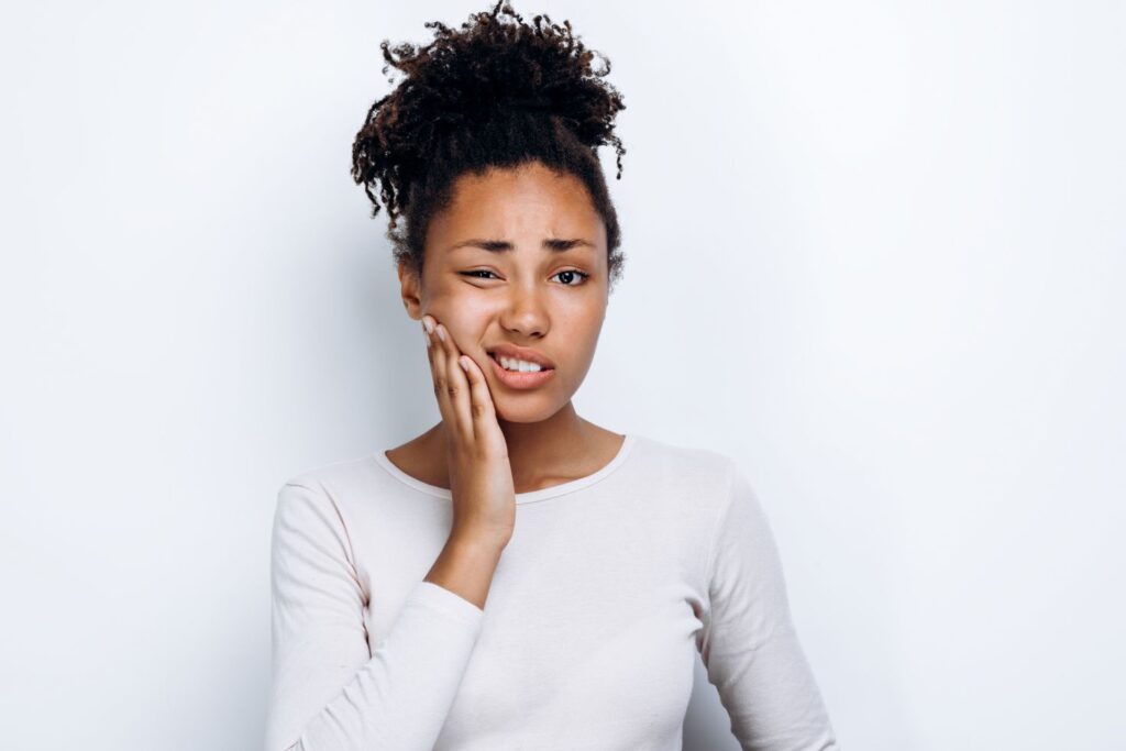 A woman with jaw pain
